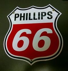 a close up of a street sign with the number 66 on it's side