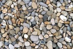 some rocks are laying on top of each other in a pile and it looks like they have been made out of stones