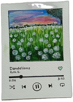 an image of dandelions in the field with music player on it's screen