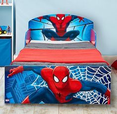 a bed with a spiderman design on it