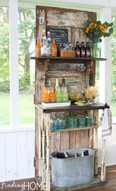 an old door is used as a bar for drinks and beverages in the sunroom