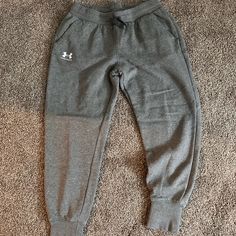 Women’s Under Armour Joggers. Never Worn. Size Medium. Under Armour Cotton Sweatpants With Pockets, Under Armour Casual Loungewear Pants, Casual Under Armour Pants For Loungewear, Casual Under Armour Pants, Casual Under Armour Loungewear Pants, Casual Cotton Pants By Under Armour, Under Armour Joggers, Jumpsuits Women, Under Armour Pants