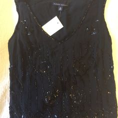 Holiday Sequin Top. Black With Silver Sequins. Sleeveless. Scalloped Bottom. Art Deco Style. Delicate, Vintage. In Excellent Condition. Comes With A Packet Of Extra Sequins. These Pics Do Not Do This Special Top Justice. Can Go With The Matching Skirt. Elegant Tank Top For Party Season, Elegant Sequined Tank Top For Evening, Elegant Tank Vest For Party, Glamorous Embellished Black Tank Top, Glamorous Black Embellished Tank Top, Elegant V-neck Vest For Party, Glamorous Evening Vest For Summer, Embellished Black Tank Top For Night Out, Elegant Embellished Tank Top For Night Out