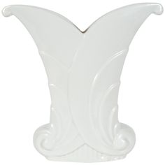 a white vase that is shaped like a butterfly