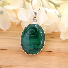 Oval Malachite Pendant, Handmade Sterling Silver Malachite Pendant, Malachite Stone Pendant Necklace Jewelry, Women Gemstone Pendant Stone Material:- Malachite  Weight (Approx.):- 10.26 Gram Length:- 38 mm Width:- 21 mm  Height:- 07 mm Stone Size (Approx.):- 25 x 18 mm Oval Total Number of Stones:  1 Stone Setting: Bezel Setting Metal: 925 Sterling Silver Finish: High Polish GN-P-1032 Oval Green Malachite Jewelry, Green Oval Malachite Jewelry, Green Oval Agate Necklaces, Oval Green Agate Necklace, Green Oval Agate Necklace, Green Agate Cabochon Necklace, Oval Malachite Necklace As Gift, Green Oval Malachite Necklaces, Green Oval Malachite Necklace