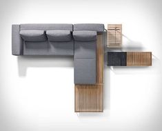 an overhead view of a modern couch with wooden slats on the back and sides