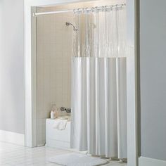 a bathroom with a shower, toilet and bathtub in it's stall area