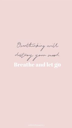 the words breathe and let go are written in white ink on a pale pink background