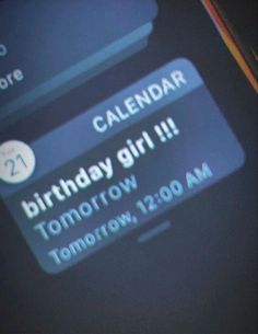 a cell phone with the text birthday girl on it's screen and an arrow in the bottom right corner