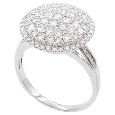 a white gold ring with diamonds on the top and bottom, set in 18k white gold