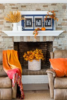 a living room with two couches and a fire place