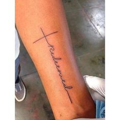 a woman's foot with a tattoo that says, faith and a cross on it