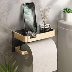 a toilet paper holder with a cell phone on it