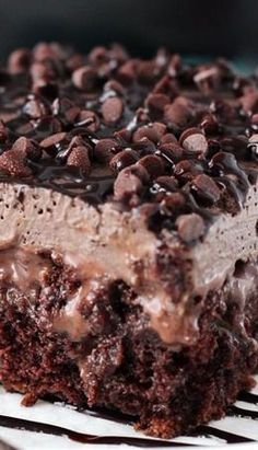 a close up of a piece of cake with chocolate and oreo pieces on it