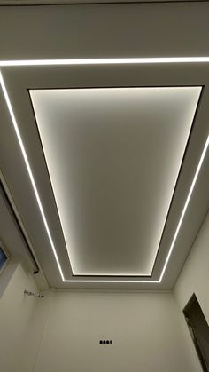 the ceiling in this bathroom is lit up with white lights and recessed light fixtures