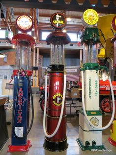 several different types of gas pumps on display