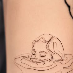 a woman's thigh with a drawing of a dog in the water