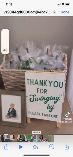 a basket filled with lots of items sitting on top of a wooden table next to a sign that says thank you for turning 40