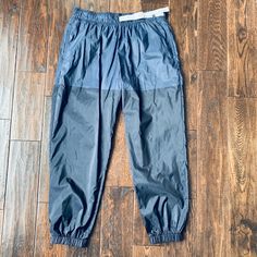 Nike Two Tone Jogger Track Pants Never Worn! Excellent Condition! Tightens At The Waist! Nike Stretch Bottoms For Outdoor, Nike Nylon Bottoms, Nike Nylon Long Pants, Nike Stretch Nylon Bottoms, Nike Blue Nylon Bottoms, Nike Nylon Bottoms With Elastic Waistband, Navy Nylon Athleisure Bottoms, Navy Nylon Bottoms With Elastic Waistband, Navy Athleisure Bottoms For Outdoor