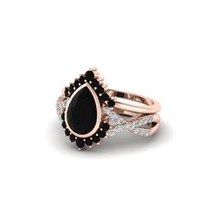 a rose gold ring with black onyx and white diamonds