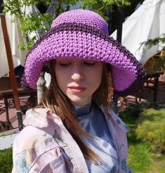 Buy a trendy raffia hat for the beach. An original and exclusive straw raffia hat that is indispensable in hot summer. Purple  panama women hat crocheted by hand. Material- 100% straw raffia. Very lightweight and absolutely not felt on the head, you can wear it even all day long. The size is universal for an adult, as a head circumference of 54- 57 cm (21- 22.5 in) would be ideal. This hat is crocheted so that it can be folded comfortably without losing its shape for further use.Has a beautiful pattern on the top.   The hat can be washed freely when it gets dirty. Product color in photo images may differ from the original due to different monitor and camera settings. And also at the yarn manufacturer, the shades of color differ in different batches of goods. There are handbags in the store Pink Brimmed Bucket Hat For The Beach, Pink Brimmed Bucket Hat For Beach, Trendy Brimmed Hats For Beach Season, One Size Brimmed Straw Summer Hat, One Size Flat Brim Sun Hat For Vacation, Handmade Wide Brim Sun Hat For Spring, Trendy Lightweight Brimmed Hat, Spring Crochet Hat With Wide Brim For Outdoor, Handmade Hats For Beach And Spring