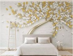 a white and yellow bedroom with a large tree mural on the wall above the bed