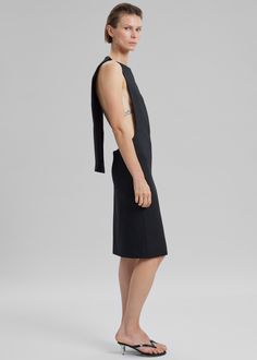 Color: Black Midweight woven fabric Classic body sculpting shift dress Midi length Sleeveless Open sides Features a cape at the back Slip-on style Unlined 49% Polyester 34% Viscose 15% Polyester 2% Elastane Dry Clean By Coperni. Imported Black Asymmetrical Neckline Pre-draped Dress, Midi Shift Dress, Long Midi Dress, Body Sculpting, Cape Dress, Midi Length Dress, Midi Length, Shift Dress, Cape