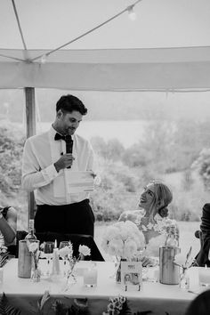 Groom reads out wedding speech at while bride looks up at him lovingly Speech Wedding, The Art Of Marriage, Bride Looks, Bride Speech, Black Tie Dress Code, Groom's Speech, Wedding Speeches, Wedding Readings