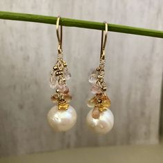 Gorgeous freshwater Pearl Drop Earrings. They are perfect in their simplicity and are incredibly elegant. There is a great deal of detail in these earrings, as you would expect from a Praha Jewelry Design piece. Description: 15mm white round pearls are suspended by 14K GF chain with pastel sapphire briollets. 2mm 14K GF seamless balls sit just above each briollet. All 14K GF and 24K vermeil components Akoya Pearl Drop Earrings In Pearl White, Akoya Pearl Drop Dangle Earrings, Classic Briolette Pearl Drop Earrings, Classic Pearl Drop Briolette Earrings, Gold Briolette Pearl Earrings With High Luster, Yellow Gold Briolette Pearl Earrings For Anniversary, Classic White Briolette Earrings, Akoya Pearl Dangle Earrings In Pearl White, Pearl White Akoya Pearl Dangle Earrings