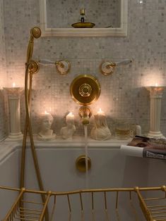 a bath tub with candles and a mirror above it