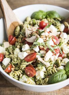 this pesto pasta salad is loaded with fresh basil, mozzarella and tomatoes