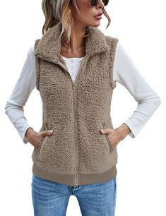 PRICES MAY VARY. ❤Plush and cozy like your favorite blanket but styled for everyday wear, the women's full zipper pockets sherpa fleece vest is a go-to layer for cool-to-cold days at the park or a tailgate. Sleeveless fleece vest jackets for women, causal fleece zip up vest, ladies fleece lounge pockets vest. ❤Features: Womens fall/ winter vest, is made out of fleece, plus hip length, tall, stand-up collar and full, front zipper design which offering plush comfort and warmth, side pockets stash Affordable Winter Vest With Buttons, Casual Washed Vest At Affordable Price, Cheap Casual Puffer Vest, Cheap Medium Wash Vest Outerwear, Affordable Stretch Breathable Vest, Cheap Stretch Winter Vest, Cheap Casual Winter Vest, Cheap Fitted Vest For Layering, Cheap Women's Vest Outerwear