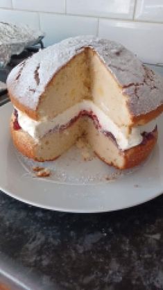 a cake that has been cut in half on a plate