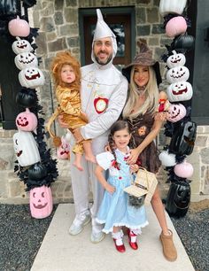 a family dressed up in costumes for halloween