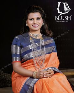 a woman in an orange and blue sari