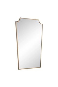 a gold framed mirror on a white wall