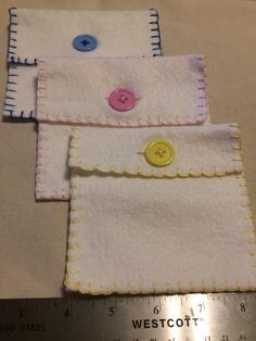 three pieces of fabric with buttons on them