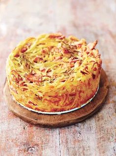 a cake sitting on top of a wooden table