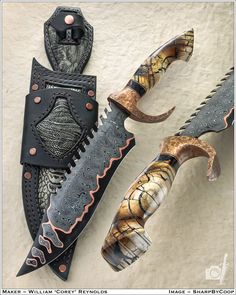 three different types of knifes with leather sheaths on top of each other,