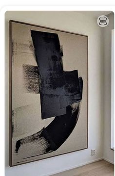 an abstract painting hanging on the wall