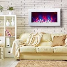 a living room filled with furniture and a fire place on the wall above it's fireplace