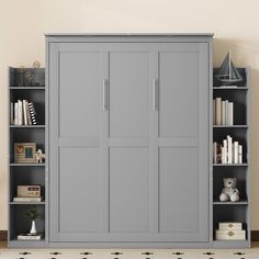 an empty bookcase with several books and toys on the shelves in front of it