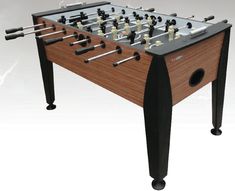 the foosball table is made from wood and metal