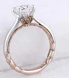 a close up view of a ring with a diamond on it's center stone