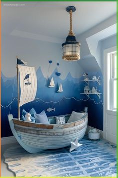 a child's room decorated in blue and white with a boat painted on the wall