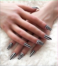 Decorating your nails for Halloween is a fun way to embrace the spooky season. This post contains 29 different Halloween nail designs you can create at home. Ideas, black, designs, art, cute, Disney, spooky, unique, simple, short, subtle, art, acrylic, almond, orange, easy Nails Stripes, Event Nails, Ongles Halloween, White Fake Nails, Black Halloween Nails, Ring Finger Nails, Purple Nail Designs