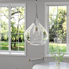 Illuminate your kitchen, entryway or dining room table with this mid-century-inspired pendant light. Featured in a variety of neutral metallic finishes, this hanging light’s wide teardrop glass shade is the perfect backdrop for a statement light bulb of your choice. The 8’ foot adjustable cord lets you customize this fixture to fit your space perfectly. Hailey Home Ida Polished Nickel Transitional Clear Glass Drum Medium Hanging Pendant Light Polyester | PD0623 Bathroom Hanging Lights, Jewelry Clothing, Cfl Bulbs, Kitchen Entryway, Statement Lighting, Outdoor Table Settings, Bathroom Inspiration Decor, Electronics Jewelry, Kitchen Island Lighting