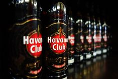 several bottles of beer lined up on a shelf