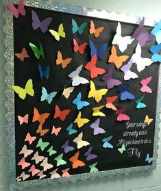 a bulletin board with colorful butterflies on it