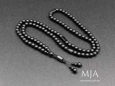 other designs www.etsy.com/shop/minejewelleryart The Mala 33 Inc  The mala in the picture has been made as 33 inches (108 beads). Different measurements are achieved by reducing the onyx beads in the front section of the mala.  The handmade necklace is made of 8,6,4 mm black onyx beads, and Ruby Zoisite, Amethyst, Or Tourmaline stones. All finished with nylon cord.  The products are custom-made and done of their kind. They can be differentiated at the minimum level from the photographs (in color Elegant Mala With 108 Beads For Meditation, Handmade Black Mala As Gift, Handmade Elegant Mala With Round Beads, Handmade Elegant Mala With Beads, Handmade Elegant Mala, Hand-strung Onyx Beaded Necklaces With Round Beads, Hand-strung Onyx Beaded Necklace With Round Beads, Spiritual Onyx Beaded Necklaces With 8mm Beads, Onyx Black Beaded Necklace For Meditation